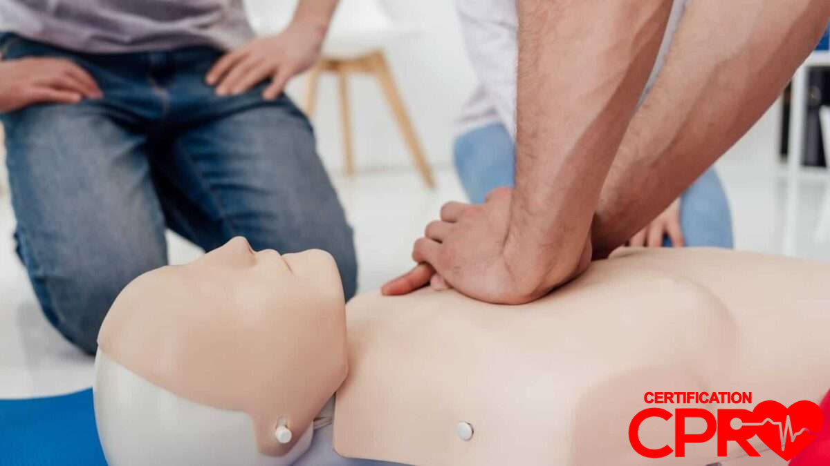 CPR training session with a man practicing on a mannequin in Nashville.